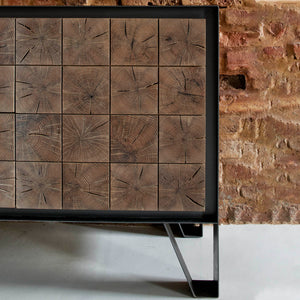 Instomi Metal Side Board by Meyer Von Wielligh. This beautiful Side Board celebrates the uniqueness of timber and tells the story of the tree from which it is made. Using a repeat pattern of the pith of the tree with a timber or metal surround, this design reveals the lifeblood of the tree while the end grain allows us to calculate the age. 