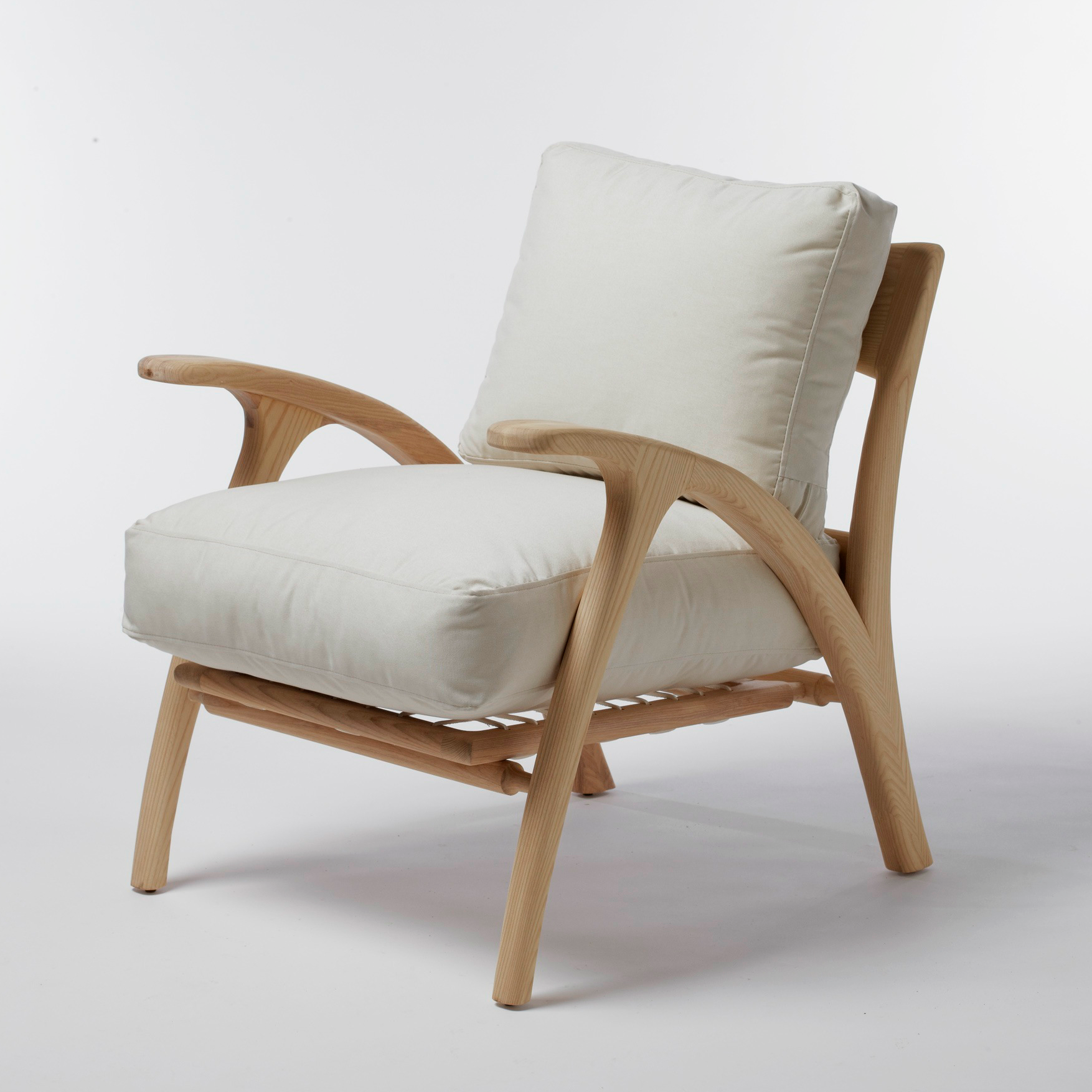 Umthi Arm Chair by Meyer Von Wielligh. Inspired by the organic lines of tree branches, the design of the Umthi range (meaning tree in Xhosa) is focused on the materials and allows the wood to dictate its natural form.