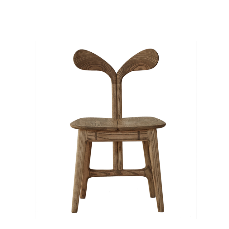 Spring Dining Chair by Meyer Von Wielligh. Inspired by the organic lines found throughout nature and the forests and lush landscape of the Garden Route, the Oak Spring Chair has playful yet contemporary lines.