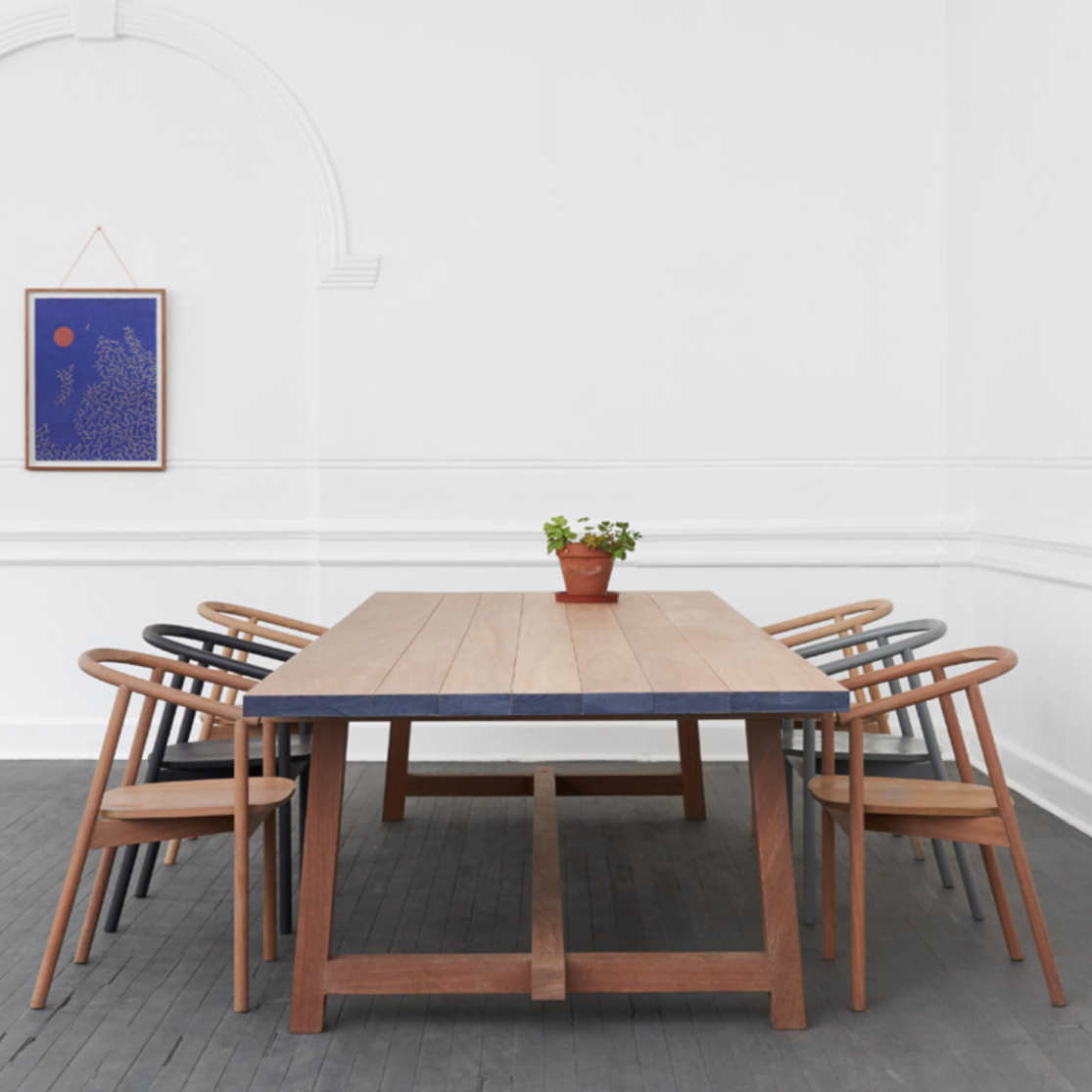 HARDWOOD CHAIR BY JAMES MUDGE. The Hardwood Chair is a striking but comfortable contemporary dining chair design. The elegant scoop of the backrest and the shaped timber seat are offset by the crisp lines of the angled timber legs.