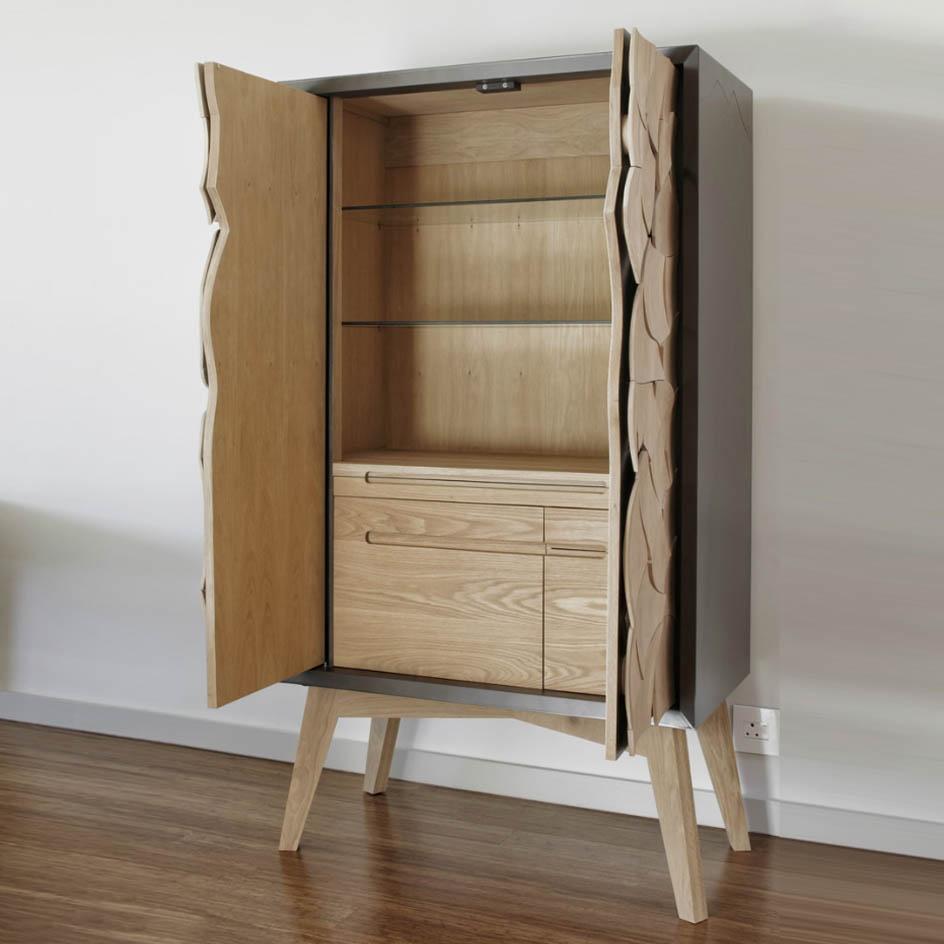 Mud Drinks Cabinet by Meyer Von Wielligh. Inspired by the cracked mud plates found on the dry riverbed of Sossusvlei in Namibia, Abrie’s homeland. The metal or timber surround of the cabinet is cleverly extended into a silhouette of the branches of a tree that is also recessed handle grips for the doors.