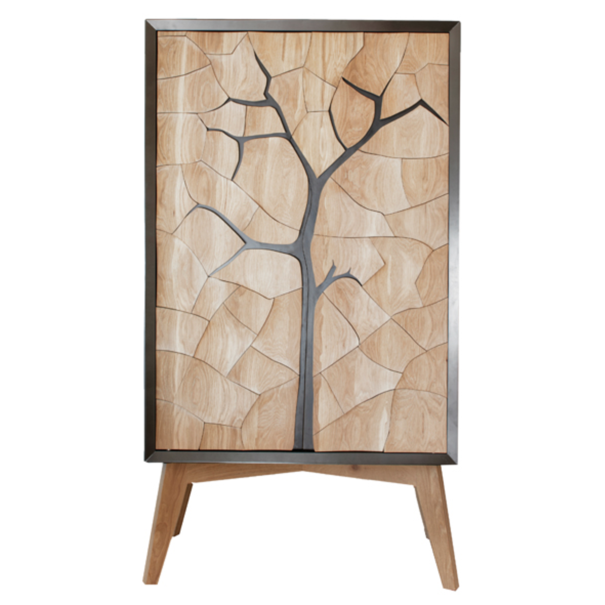 Mud Drinks Cabinet by Meyer Von Wielligh. Inspired by the cracked mud plates found on the dry riverbed of Sossusvlei in Namibia, Abrie’s homeland. The metal or timber surround of the cabinet is cleverly extended into a silhouette of the branches of a tree that is also recessed handle grips for the doors.