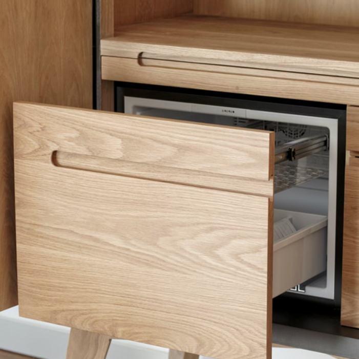 Mud Drinks Cabinet by Meyer Von Wielligh. Inspired by the cracked mud plates found on the dry riverbed of Sossusvlei in Namibia, Abrie’s homeland. The metal or timber surround of the cabinet is cleverly extended into a silhouette of the branches of a tree that is also recessed handle grips for the doors.