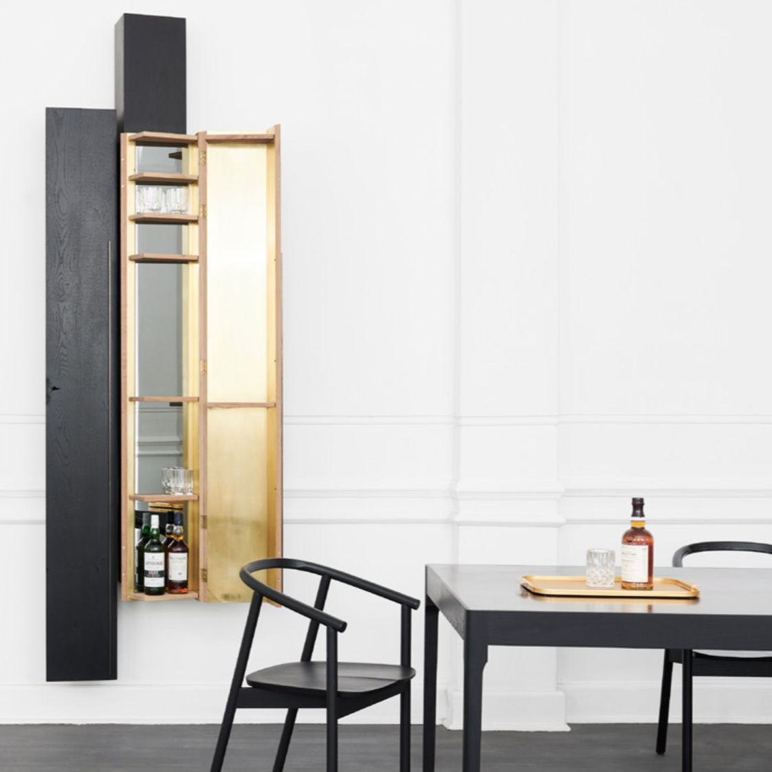 HARDWOOD CHAIR BY JAMES MUDGE. The Hardwood Chair is a striking but comfortable contemporary dining chair design. The elegant scoop of the backrest and the shaped timber seat are offset by the crisp lines of the angled timber legs.