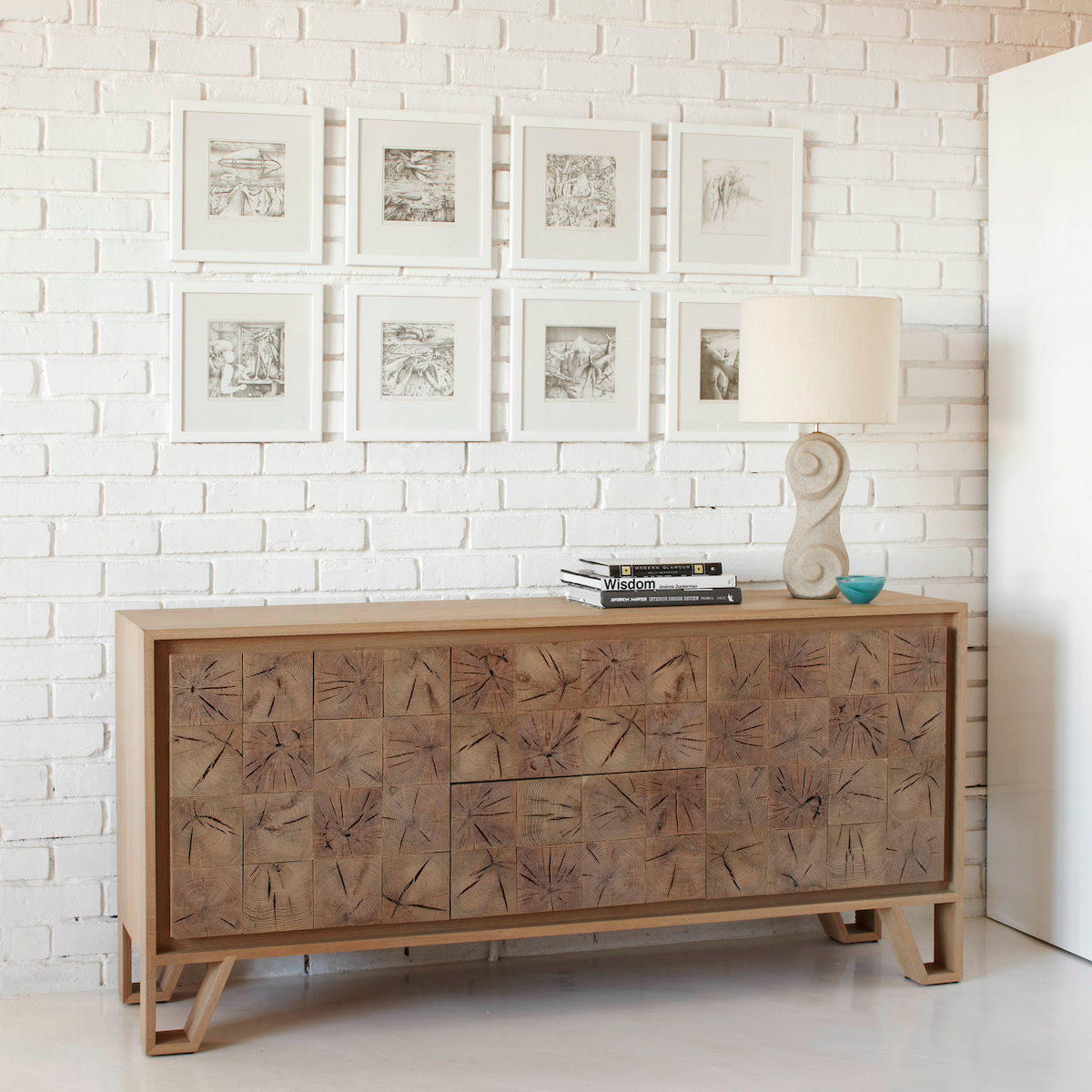 Instomi Side Board by Meyer Von Wielligh. This beautiful side board celebrates the uniqueness of the timber and tells the story of the tree from which it is made. Instomi Sideboard (meaning stories in Xhosa) celebrates the uniqueness of timber and tells the story of the tree from which it is made. Using a repeat pattern of the pith of the tree with a timber or metal surround, this design reveals the lifeblood of the tree while the end grain allows us to calculate the age.