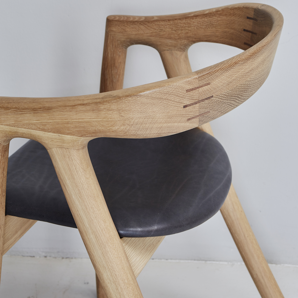 Umthi Dining Chair by Meyer Von Wielligh. The design allows the wood to dictate its natural form. The Umthi Dining Chair is inspired by the organic lines of tree branches.