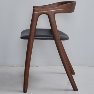 Umthi Dining Chair by Meyer Von Wielligh. The design allows the wood to dictate its natural form. The Umthi Dining Chair is inspired by the organic lines of tree branches.