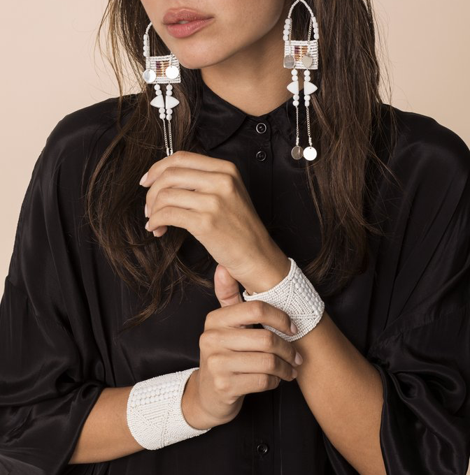 WIDE LEATHER CUFF -  JEWELRY BY SIDAI DESIGNS. An intricately beaded leather bracelet from our Sipolio collection. This collection shares the journey of boyhood to warriorhood of a young Maasai male, who wears black and adorns himself with white beaded jewelry and detailed face markings.