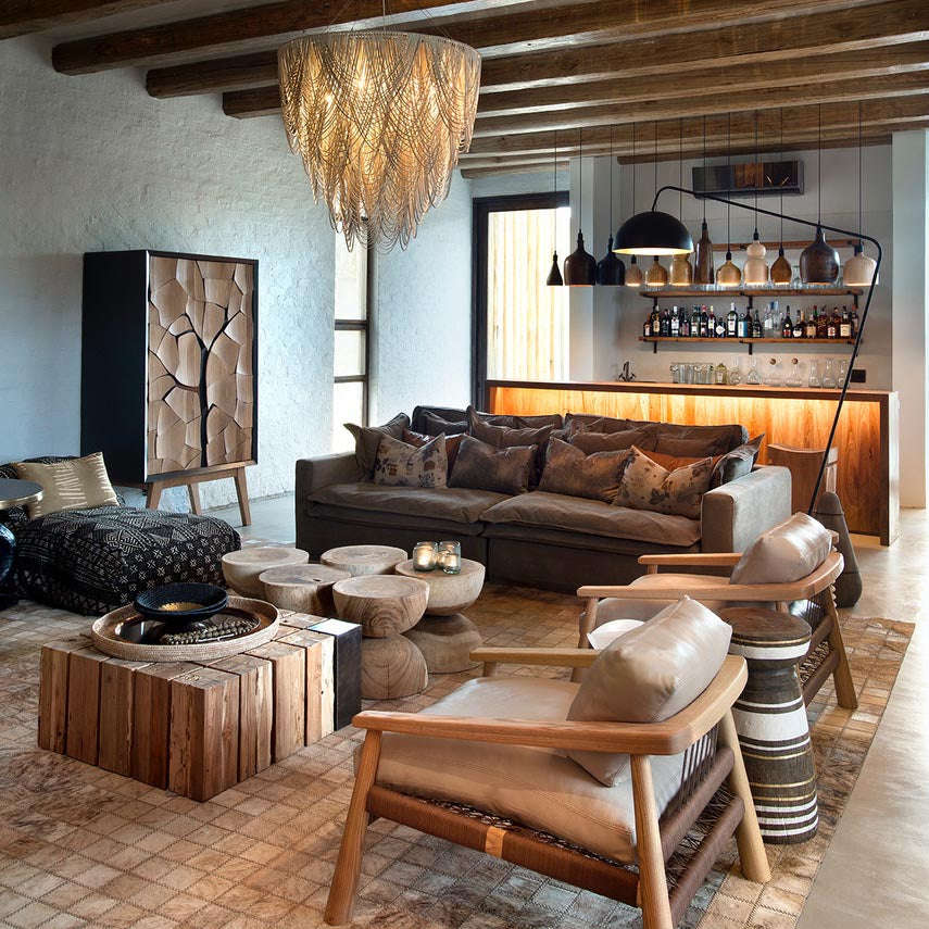 Mud Drinks Cabinet by Meyer Von Wielligh. Inspired by the cracked mud plates found on the dry riverbed of Sossusvlei in Namibia, Abrie’s homeland. The metal or timber surround of the cabinet is cleverly extended into a silhouette of the branches of a tree that is also recessed handle grips for the doors. 