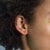 SKULL  EARRINGS - JEWELRY BY KIRSTEN GOSS. Miniature skull stud earrings, a delicate reminder of our mortality. Exciting mini studs to be mixed and matched. Beautifully handmade in 18kt gold vermeil. 