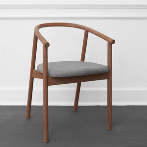 HARDWOOD CHAIR BY JAMES MUDGE. The Hardwood Chair is a striking but comfortable contemporary dining chair design. The elegant scoop of the backrest and the shaped timber seat are offset by the crisp lines of the angled timber legs. 