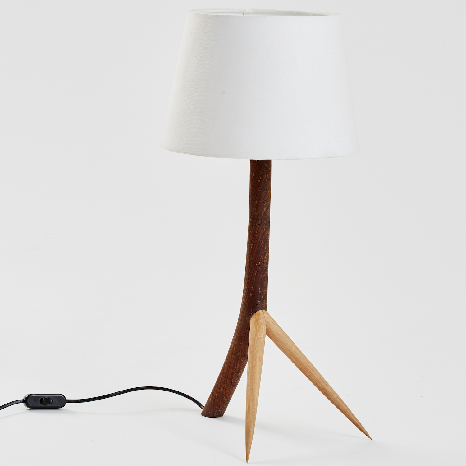 Thorn Table Lamp by Meyer Von Wielligh. This original table lamp with its tripod legs is inspired by the thorns of the iconic African thorn tree. This lamp has a white lamp shade.