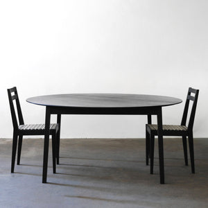 Tapered round table Ash charcoal with riempie chairs.jpg