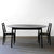Tapered round table Ash charcoal with riempie chairs.jpg