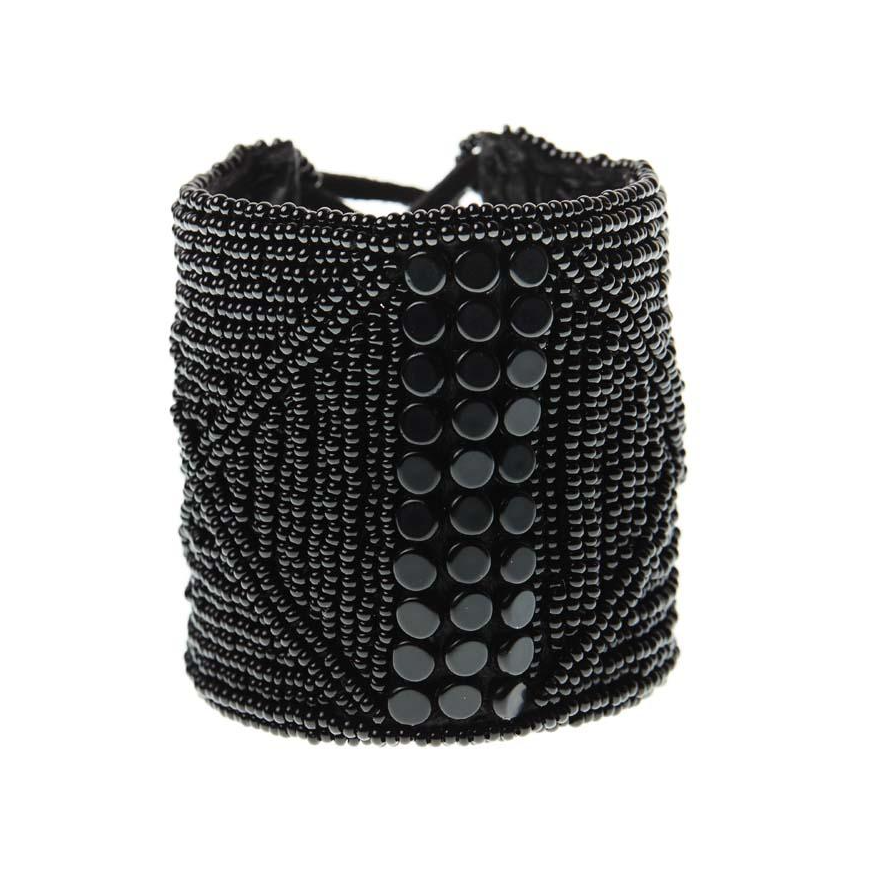 WIDE LEATHER CUFF -  JEWELRY BY SIDAI DESIGNS. An intricately beaded leather bracelet from our Sipolio collection. This collection shares the journey of boyhood to warriorhood of a young Maasai male, who wears black and adorns himself with white beaded jewelry and detailed face markings.
