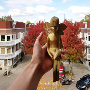 gold butterfly girl in Amsterdam.jpg