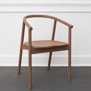 HARDWOOD CHAIR BY JAMES MUDGE. The Hardwood Chair is a striking but comfortable contemporary dining chair design. The elegant scoop of the backrest and the shaped timber seat are offset by the crisp lines of the angled timber legs. 