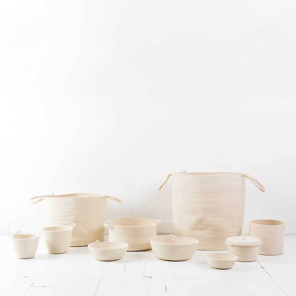 PLANTER BASKET IVORY BY MIA MELANGE. Add some greenery to your home with these unique planters. Available in three sizes. Made from 100% cotton rope which is sewn together in a coiling technique.