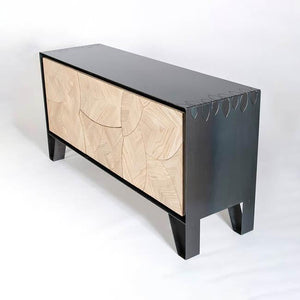 Leaf Sideboard by Meyer Von Wielligh. Part of the Leaf Range and inspired by the organic lines found throughout nature, the Leaf Sideboard is made up of a scalloped pattern of leaf-shaped, textural wooden panels, that sit either within a metal or a timber surround. 