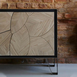 Leaf Sideboard by Meyer Von Wielligh. Part of the Leaf Range and inspired by the organic lines found throughout nature, the Leaf Sideboard is made up of a scalloped pattern of leaf-shaped, textural wooden panels, that sit either within a metal or a timber surround. 