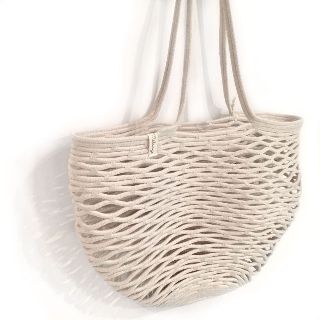 NET BAG IVORY BY MIA MELANGE. Make a statement at your local market with this unique net bag. These net bags are durable and expand as more goods are placed in the bag. Made from 100% cotton rope. 
